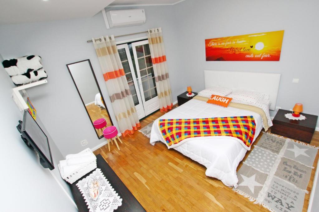 Postel nebo postele na pokoji v ubytování Guest House Pereira