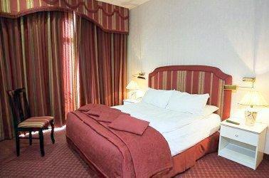 Postel nebo postele na pokoji v ubytování Addar Hotel