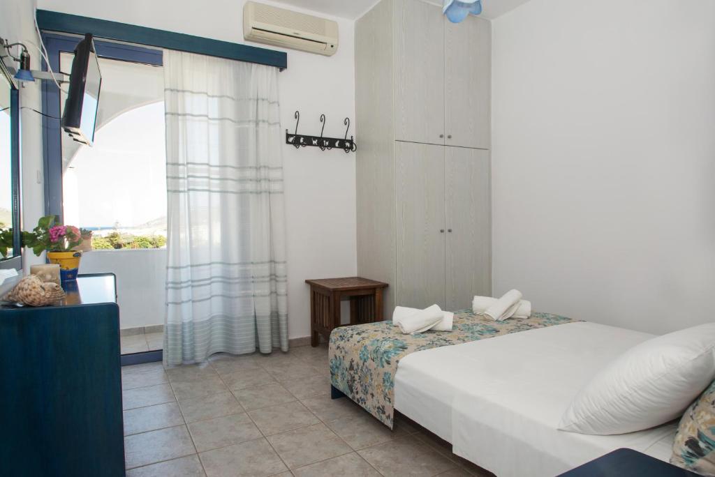 Postel nebo postele na pokoji v ubytování Maistrali Apartments