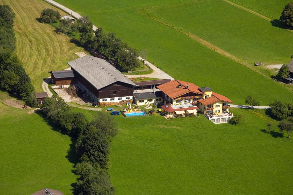 an aerial view of a large house in a field at Hinteraigengut in Flachau