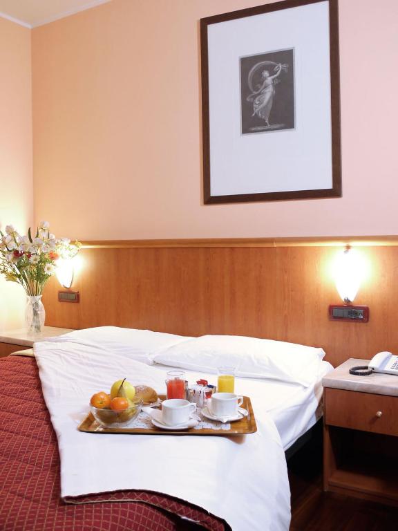 Postel nebo postele na pokoji v ubytování Hotel Dal Ponte