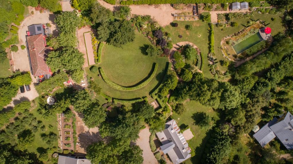 an overhead view of a park with trees and buildings at Planetrees Estate in Beechworth