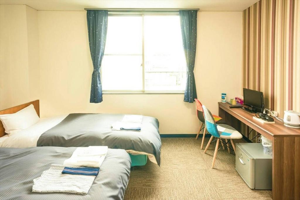 Postel nebo postele na pokoji v ubytování Hotel Ina