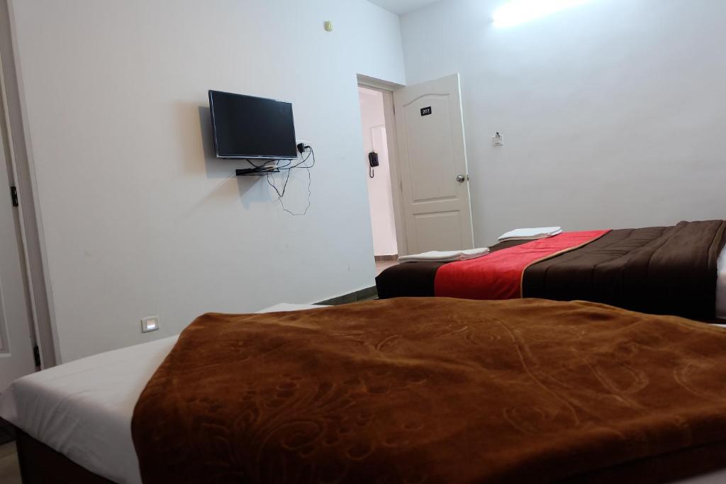 Postel nebo postele na pokoji v ubytování Rosepark Residency
