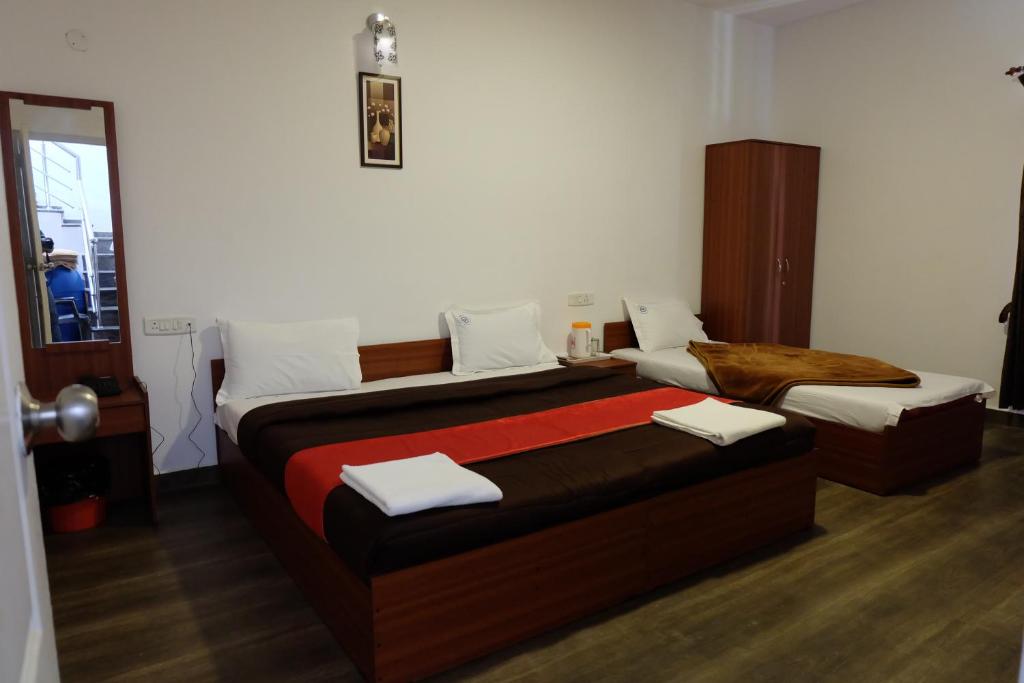 Postel nebo postele na pokoji v ubytování Rosepark Residency