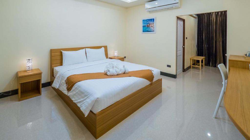 Postel nebo postele na pokoji v ubytování AU Place Hotel