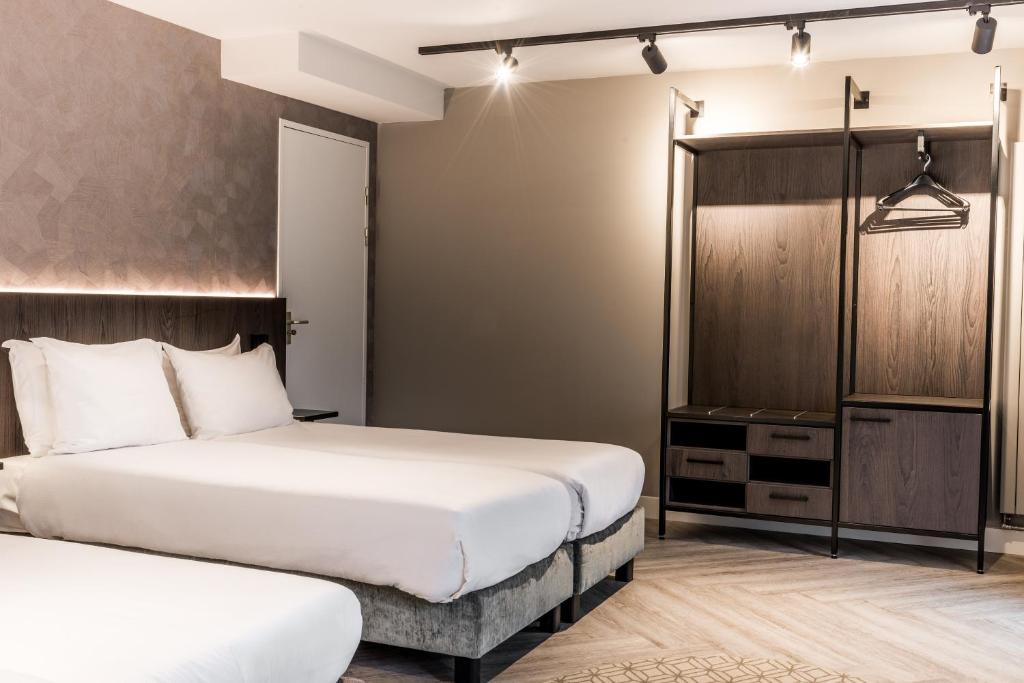 Postel nebo postele na pokoji v ubytování Sandton Eindhoven Centre