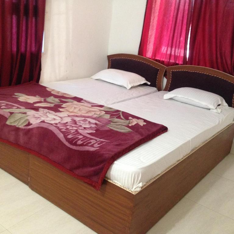 Postel nebo postele na pokoji v ubytování Rama Guest House