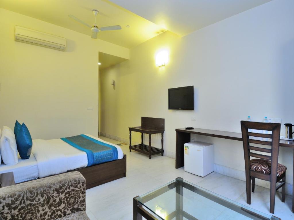 Postel nebo postele na pokoji v ubytování Hotel Shanti Villa