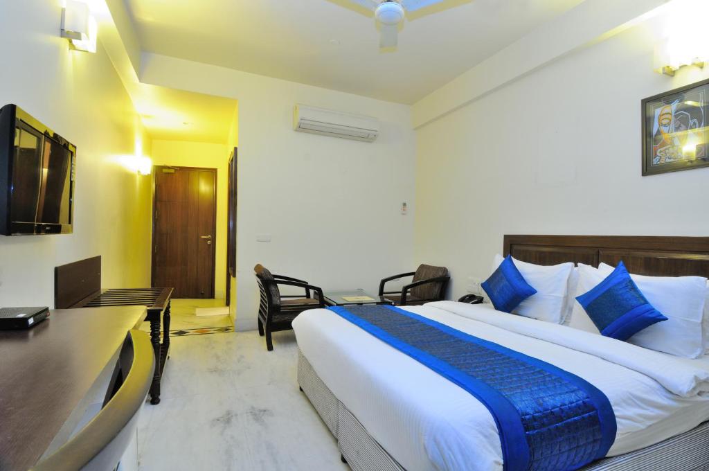 Postel nebo postele na pokoji v ubytování Hotel Shanti Villa