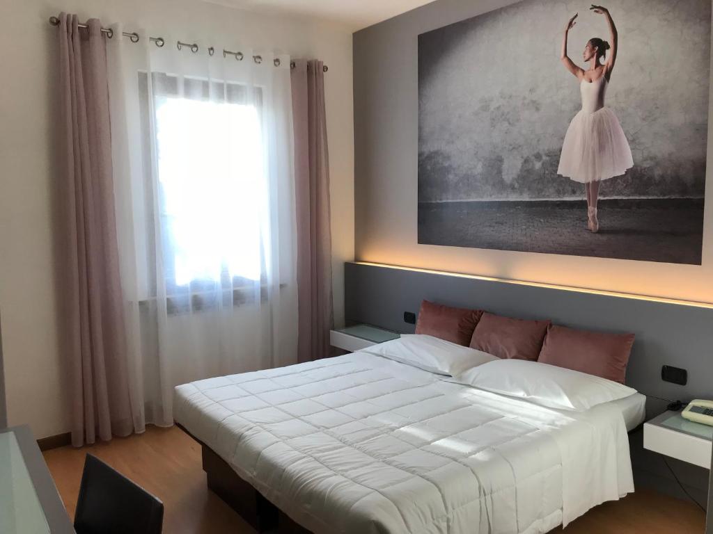 Postel nebo postele na pokoji v ubytování Hotel Gattopardo