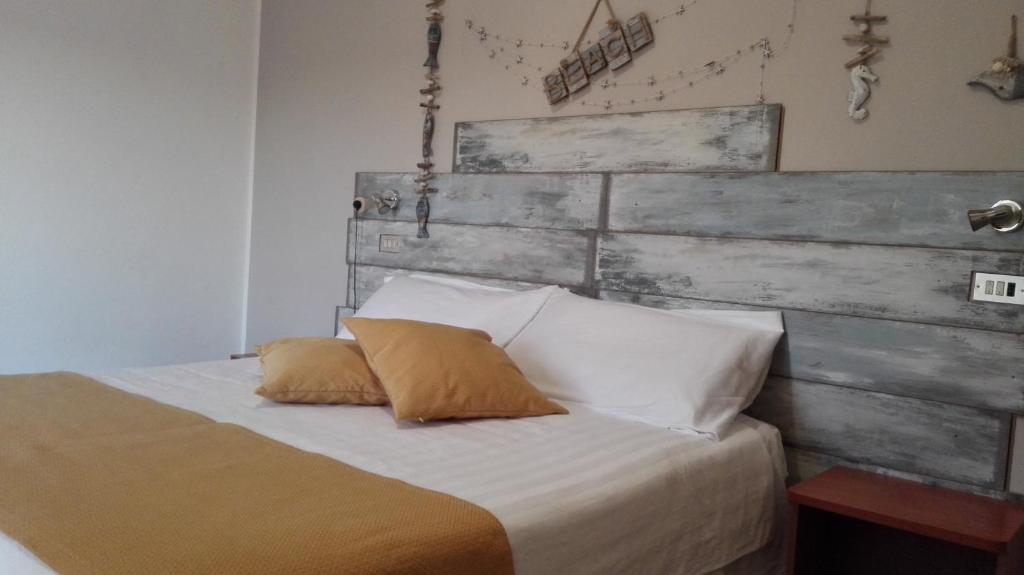 Postel nebo postele na pokoji v ubytování Hotel Sandra