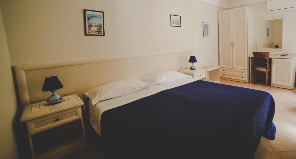 Postel nebo postele na pokoji v ubytování Casa Vacanze Vittoria