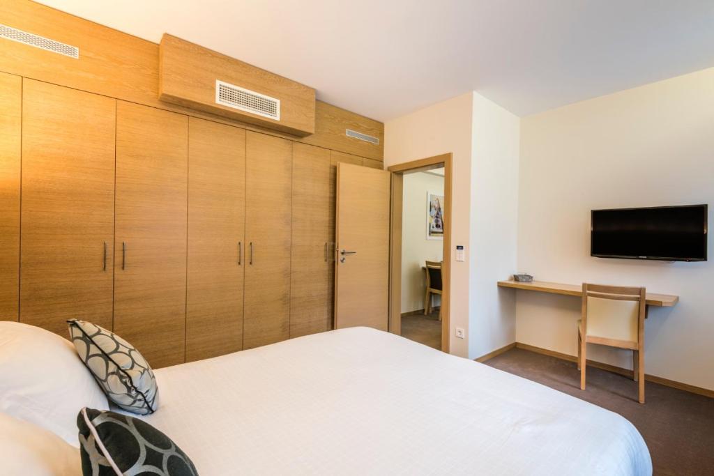 Postel nebo postele na pokoji v ubytování Hotel Bon Repos