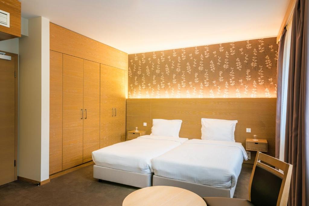 Postel nebo postele na pokoji v ubytování Hotel Bon Repos