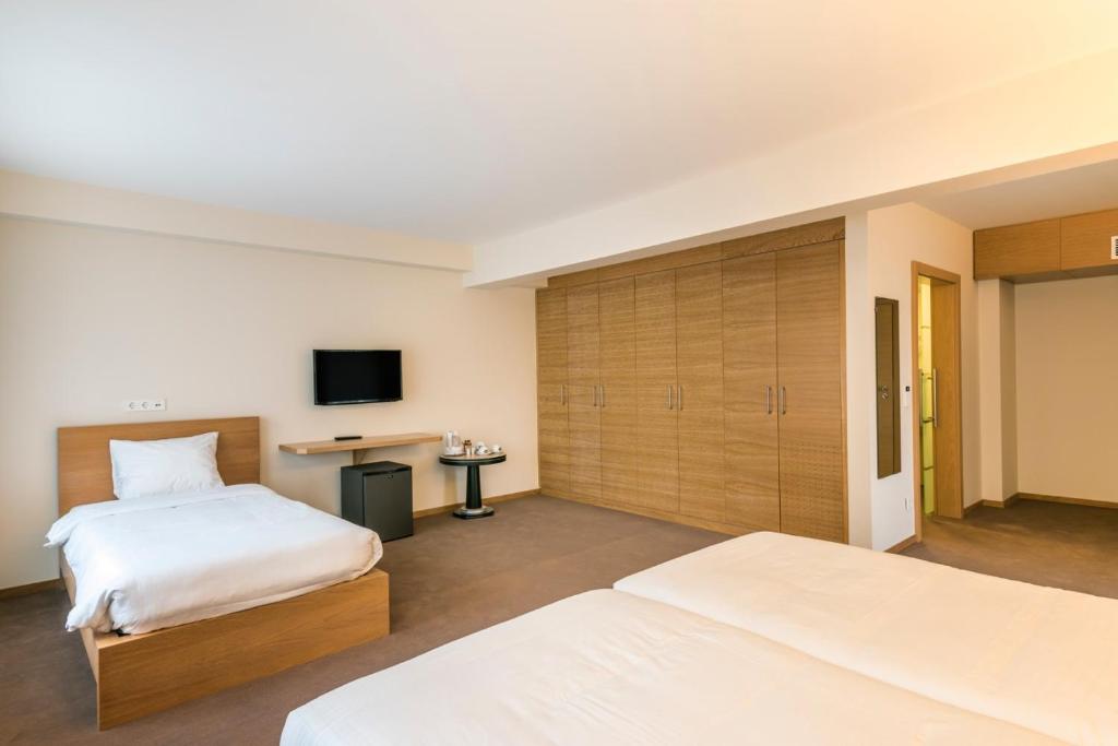 Postel nebo postele na pokoji v ubytování Hotel Bon Repos