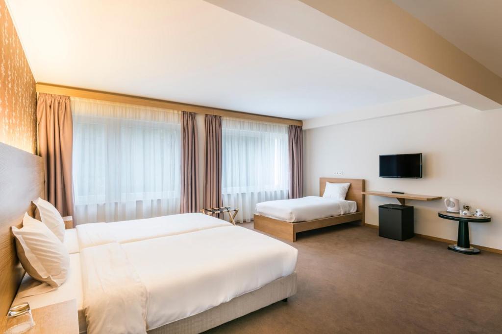 Postel nebo postele na pokoji v ubytování Hotel Bon Repos