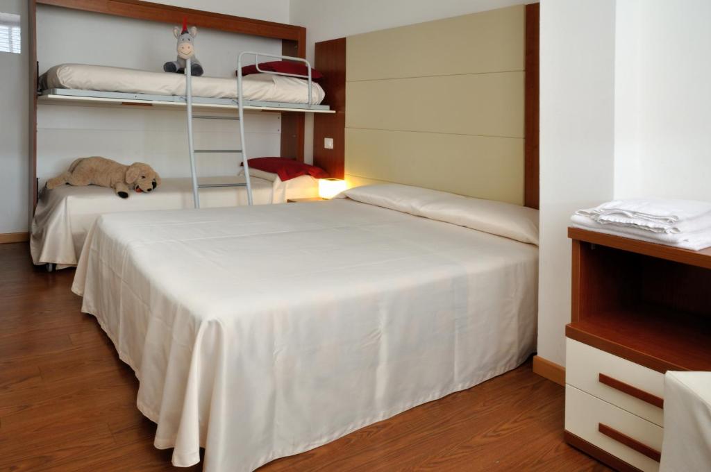 Postel nebo postele na pokoji v ubytování Hotel Mezzaluna