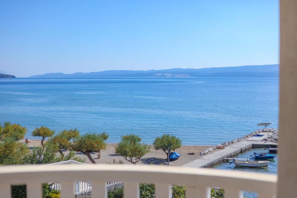 a view of the beach from a balcony at Villa Cetina in Omiš