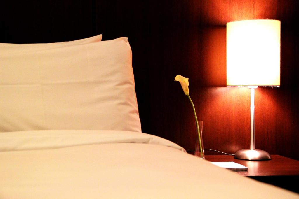 Postel nebo postele na pokoji v ubytování H3 Hotel Paulista