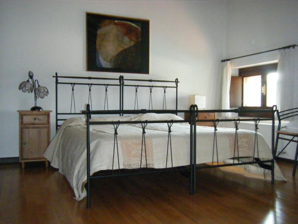 Postel nebo postele na pokoji v ubytování Agriturismo Grillo Iole Winery