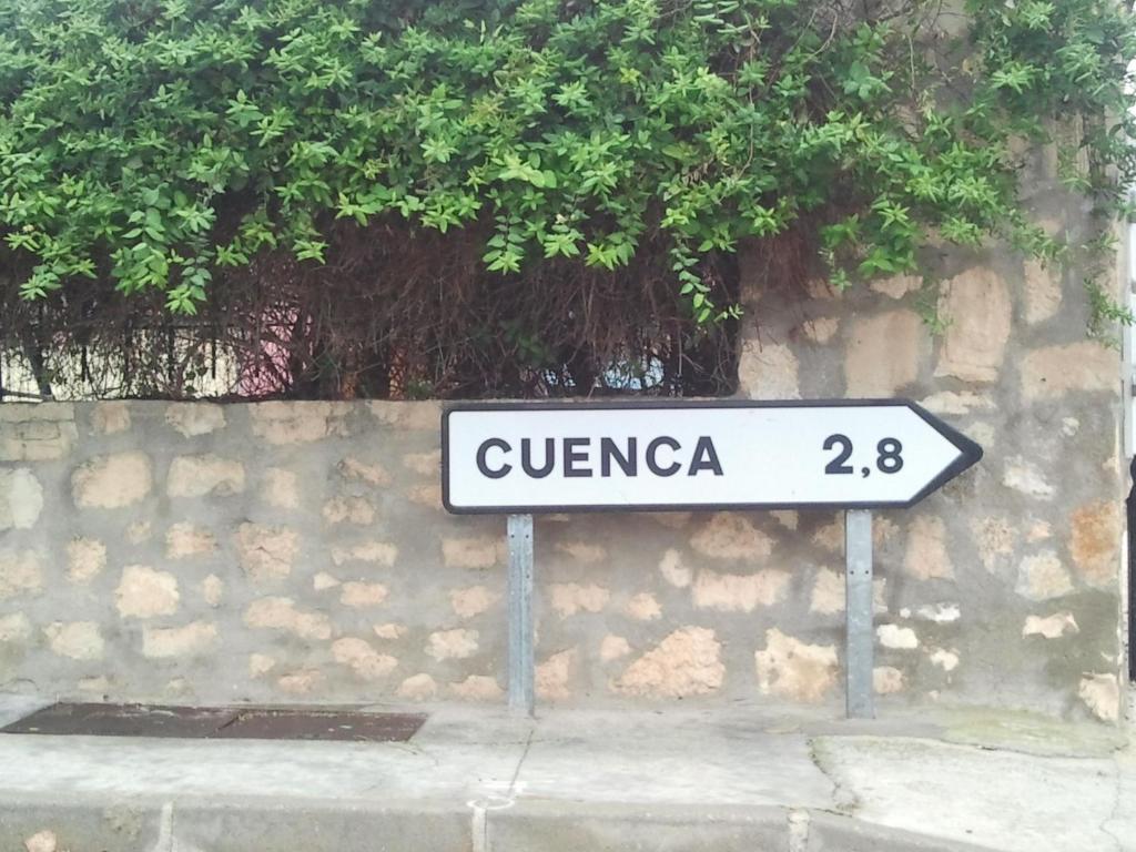 a street sign in front of a stone wall at Casa De Nohales in Nohales