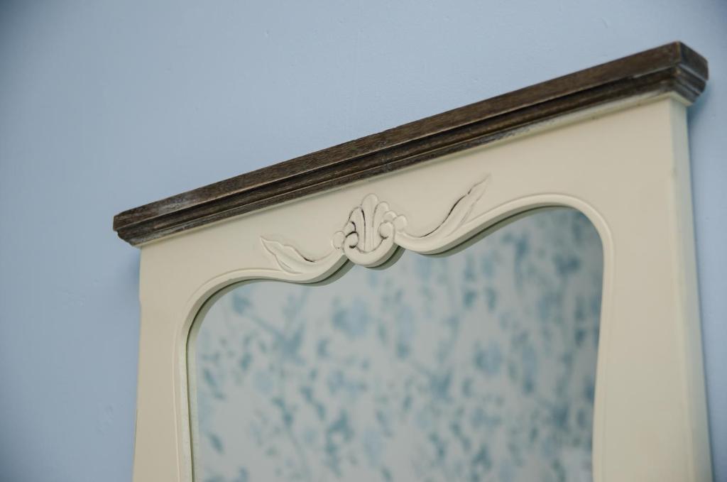 a framed mirror on a wall in a room at The Carrick in Portrush
