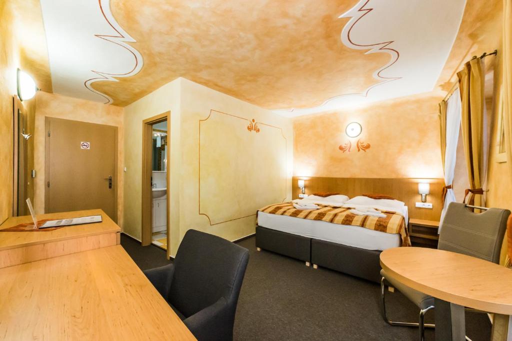 Łóżko lub łóżka w pokoju w obiekcie Pension Galko