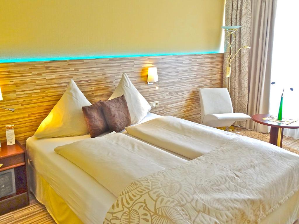 Postel nebo postele na pokoji v ubytování Hotel Scheidberg