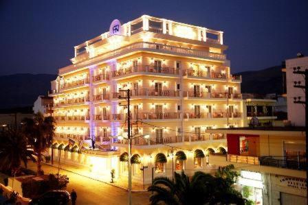 a large building with lights on it at night at Nafsika Palace Delphi-Itea in Itea