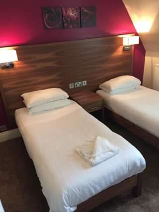 Postel nebo postele na pokoji v ubytování Wheatlands Lodge Hotel