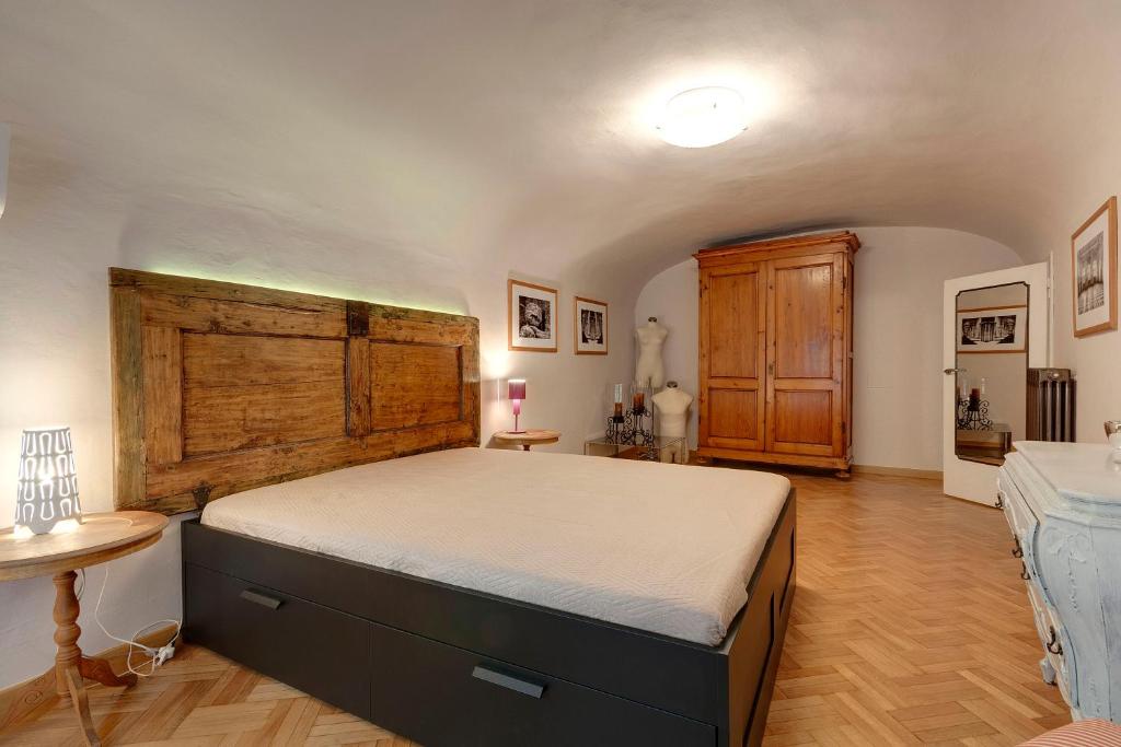 Łóżko lub łóżka w pokoju w obiekcie Capitelli Suite