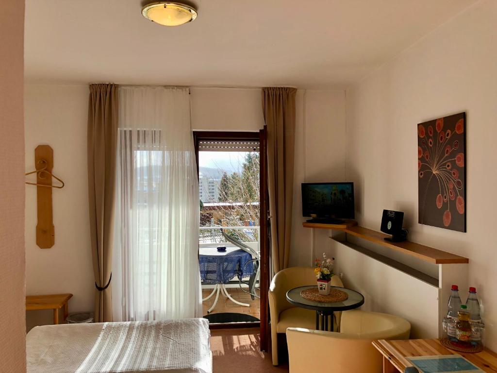 TV a/nebo společenská místnost v ubytování Hotel Del Sol