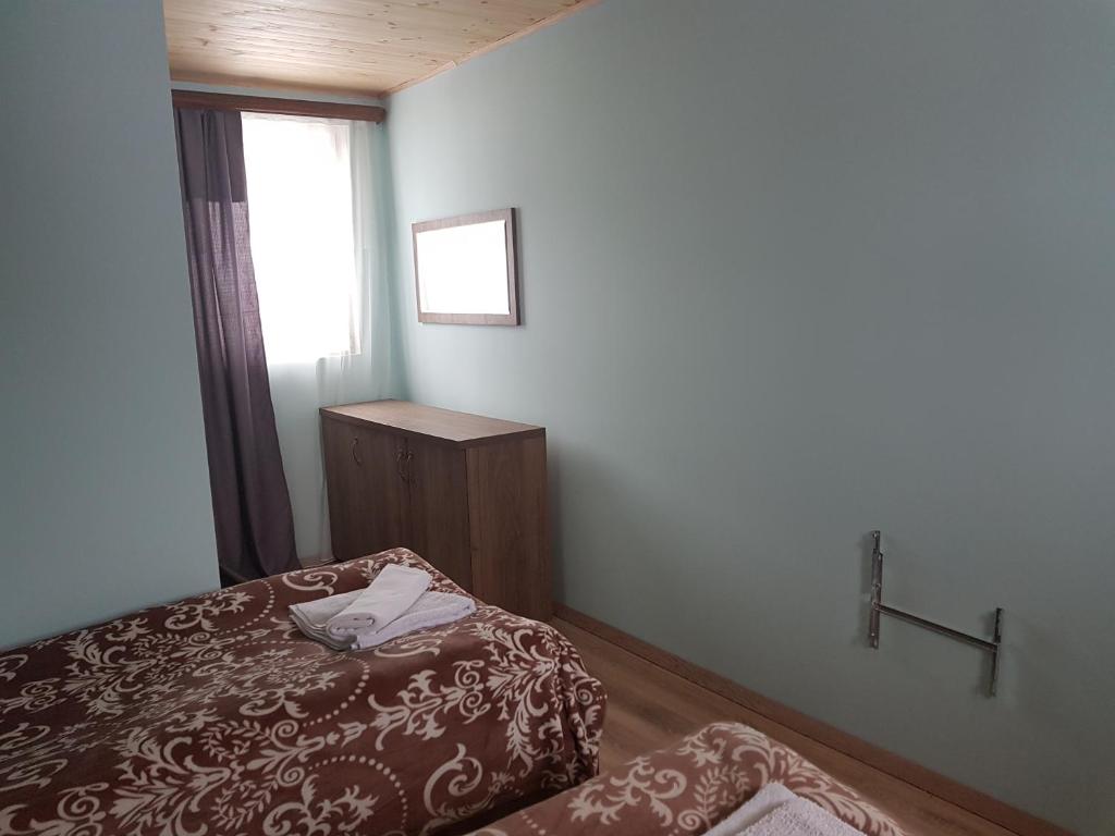 Postel nebo postele na pokoji v ubytování Guest House Khergiani