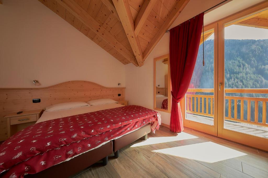 Postel nebo postele na pokoji v ubytování Abete Rosso