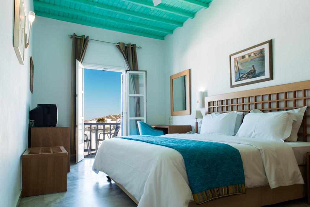 Posteľ alebo postele v izbe v ubytovaní Poseidon Hotel Suites