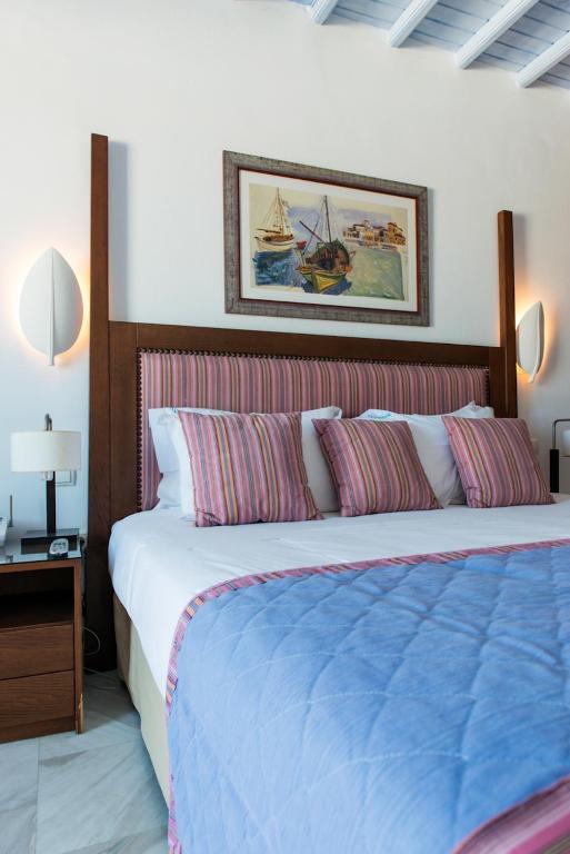 Posteľ alebo postele v izbe v ubytovaní Poseidon Hotel Suites