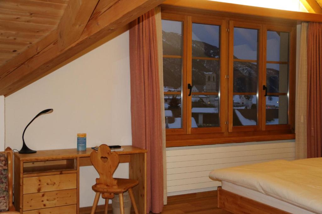 Postel nebo postele na pokoji v ubytování Hotel Helvetia