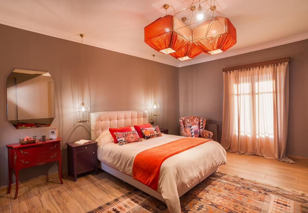 Postel nebo postele na pokoji v ubytování Ef Zin Hotel Arachova