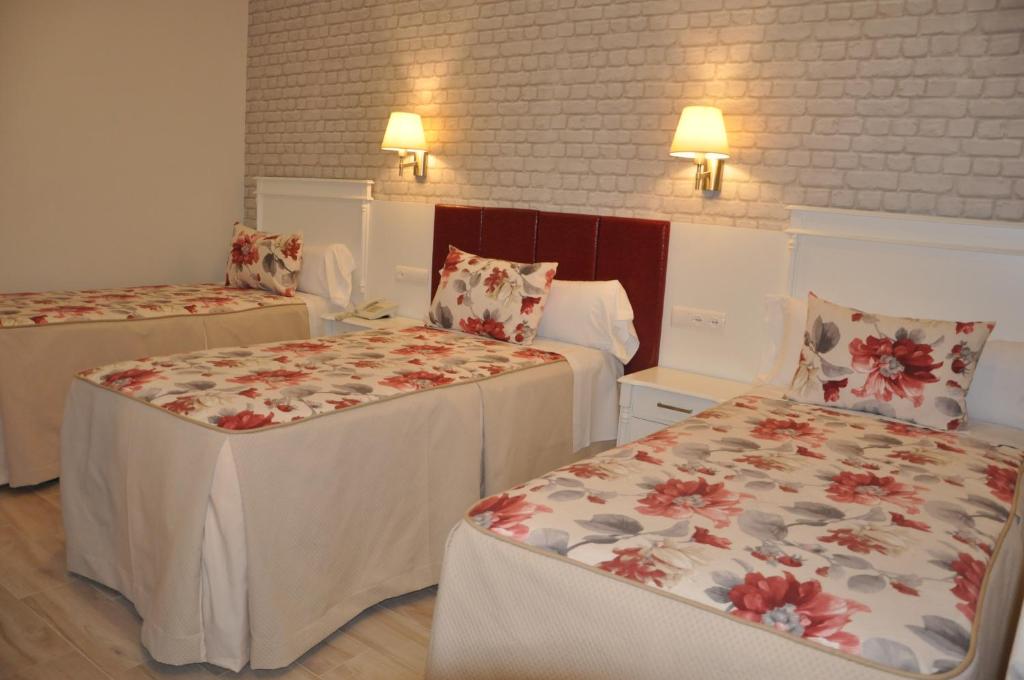 Postel nebo postele na pokoji v ubytování Hotel Selu