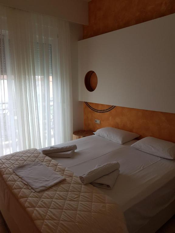Postel nebo postele na pokoji v ubytování Hotel George