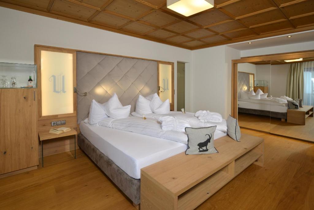Postel nebo postele na pokoji v ubytování Hotel Unterwirt