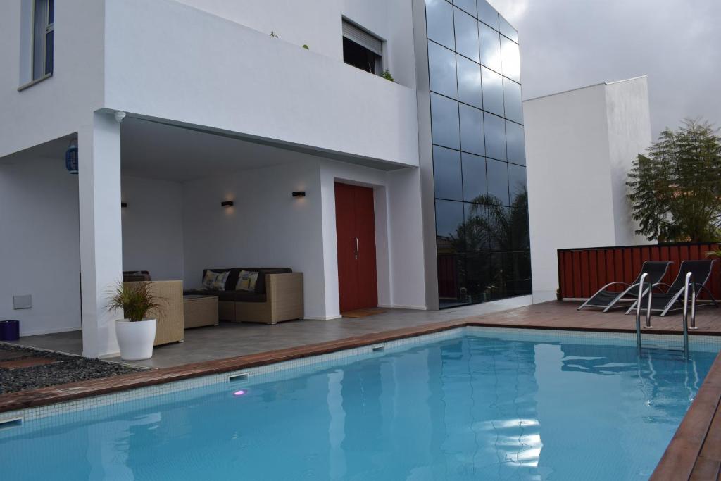 a swimming pool in front of a building at Villa Cristal in La Orotava