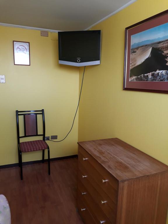 TV a/nebo společenská místnost v ubytování Hotel Aymara