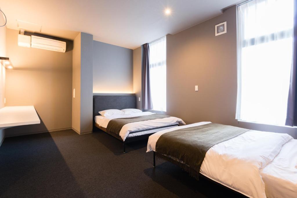 Postel nebo postele na pokoji v ubytování BON Hostel