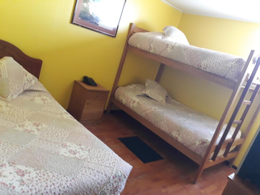 Postel nebo postele na pokoji v ubytování Hotel Aymara
