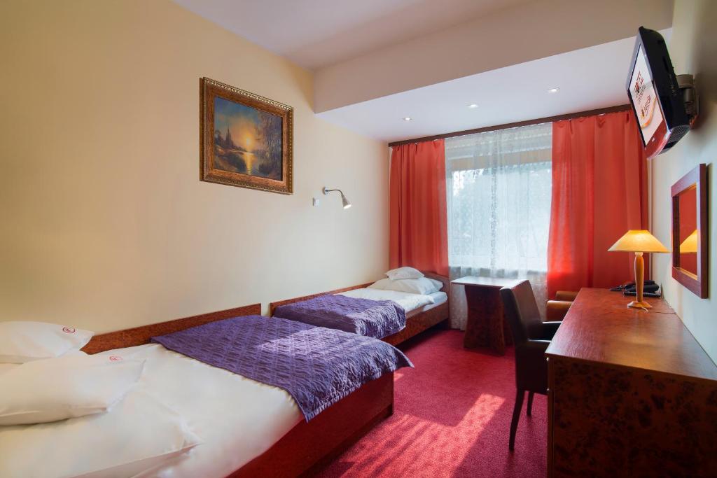 Postel nebo postele na pokoji v ubytování Hotel Continental