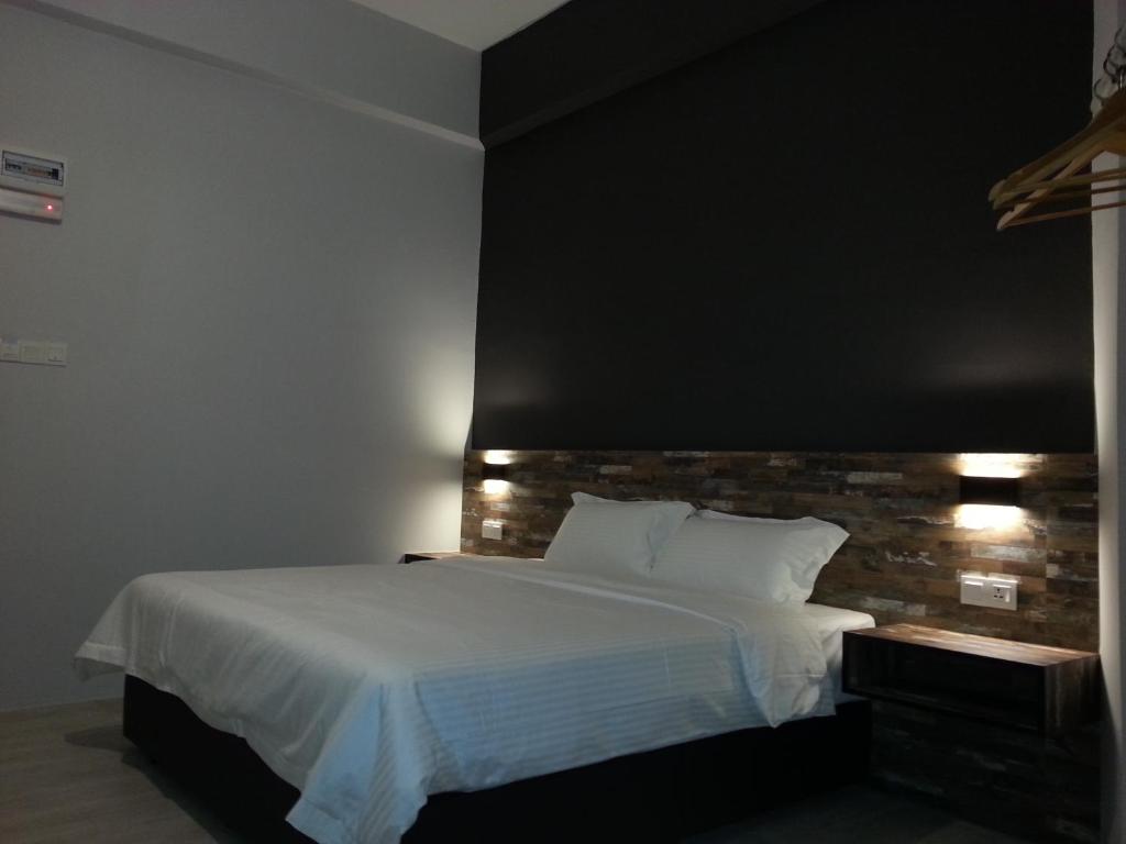 Postel nebo postele na pokoji v ubytování L Hotel