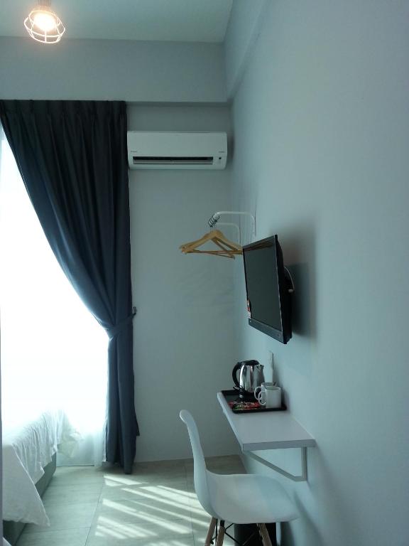 TV a/nebo společenská místnost v ubytování L Hotel
