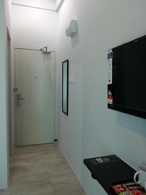 TV a/nebo společenská místnost v ubytování L Hotel